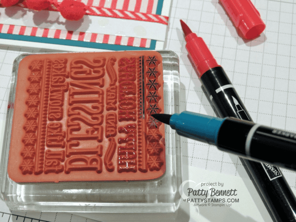 Use Stampin' Write markers to selectively color a portion of the Six Sayings hostess stamp from Stampin' Up!.  Happy Holidays penguin card by Patty Bennett