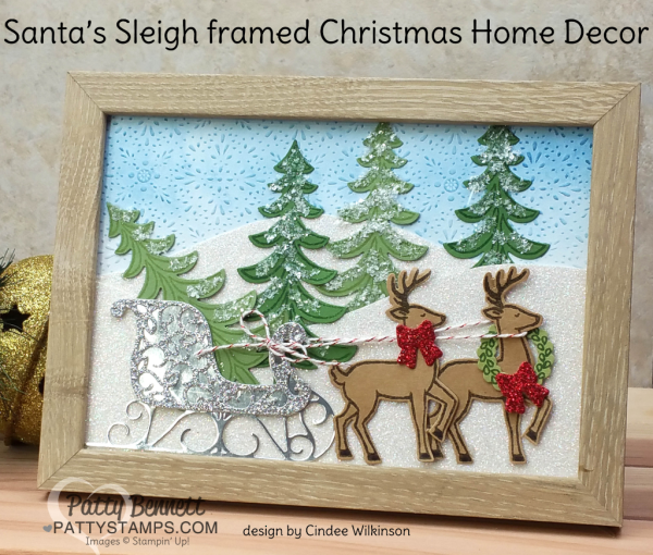 Framed Home Christmas Decor piece featuring Stampin' Up! Santa's Sleigh stamp set and framelit set. Cute Reindeer and sleigh on a glimmery snowy hillside!