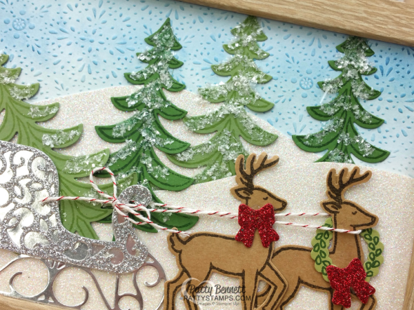 Framed Home Christmas Decor piece featuring Stampin' Up! Santa's Sleigh stamp set and framelit set. Cute Reindeer and sleigh on a glimmery snowy hillside!