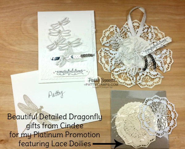 Detailed Dragonfly congratulations card with Falling Petals embossing folder, vellum and silver foil paper from Stampin' UP!. Lace Doily hanging ornament with Detailed Dragonflies. Gift from Cindee.