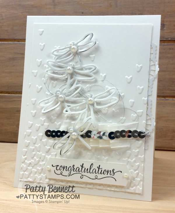Detailed Dragonfly congratulations card with Falling Petals embossing folder, vellum and silver foil paper from Stampin' UP!. Gift from Cindee.