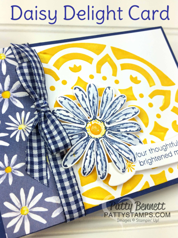 Daisy Delight bundle card idea featuring Stampin' UP! embossing paste, medallion mask, Daisy Delight stamp set and punch and Delightful Daisy designer paper. Topped off with Night of Navy Ginham ribbon. By Patty Bennett