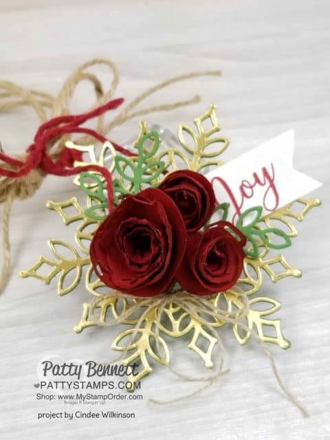 Snowfall Snowflake thinlit dies from Stampin' UP! paired with handmade paper flower rosettes. Perfect package tag or Christmas Tree ornament. Created by Cindee Wilkinson