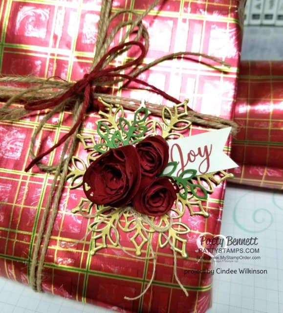 Snowfall Snowflake thinlit dies from Stampin' UP! paired with handmade paper flower rosettes. Perfect package tag or Christmas Tree ornament. Created by Cindee Wilkinson