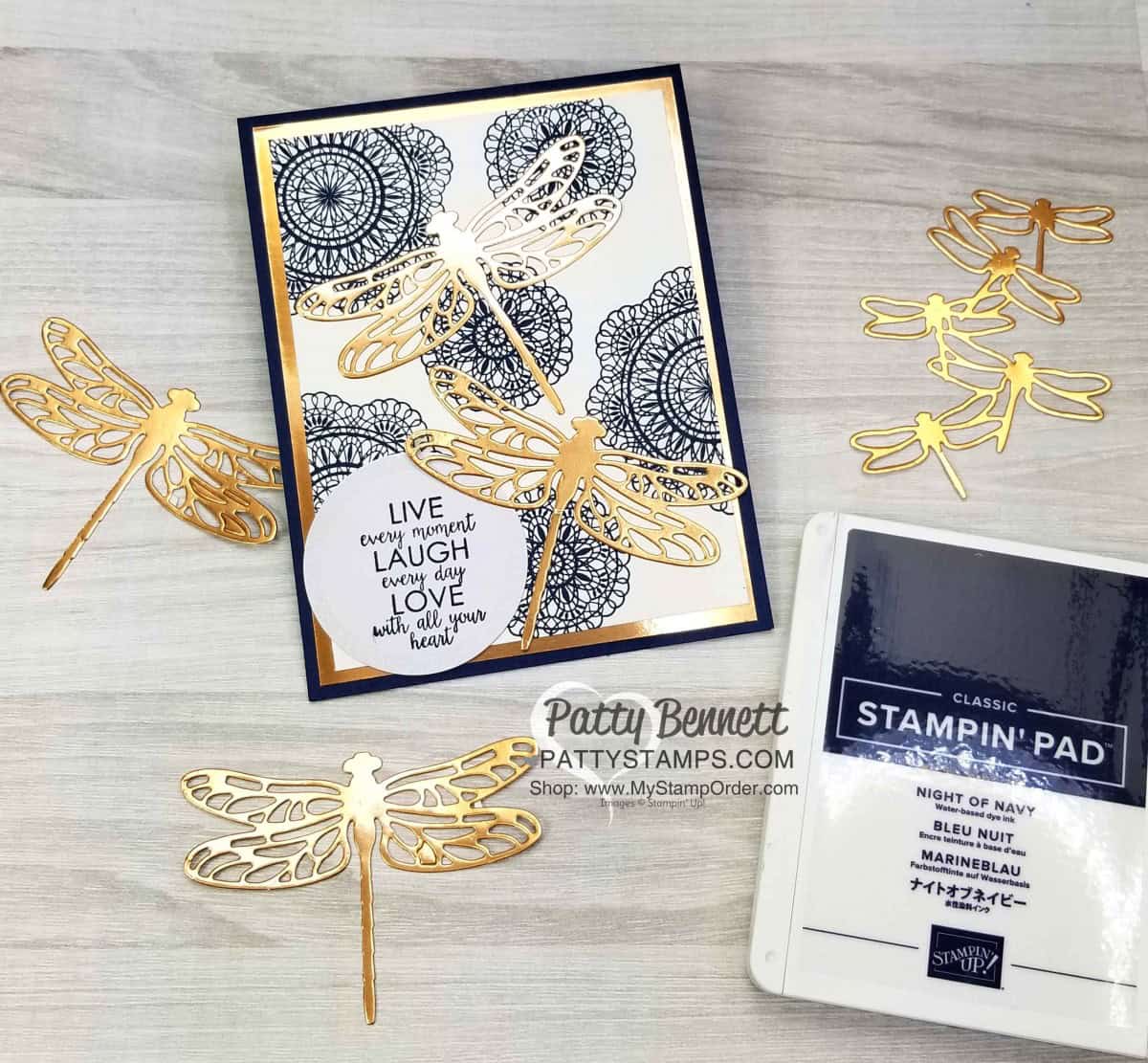 Stampin' UP! Dear Doily stamp set background in Night of Navy ink, with Copper Foil paper mat and Copper Foil Detailed Dragonfly die cuts. Greeting stamped on Sweet Pins & Tags tag. www.PattyStamps.com