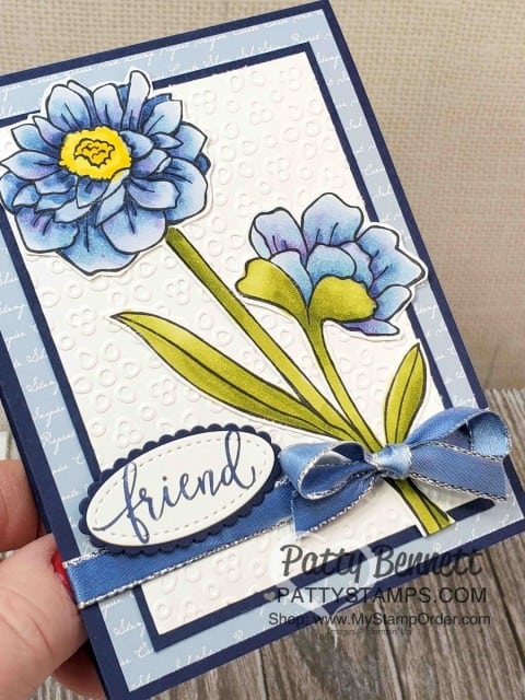 Stampin' Up! Band Together Stamp Set, #149231 colored with Stampin' Blends alcohol markers in blue. Custom colored ribbon with Stampin' Blends. Eyelet Lace embossing folder background. by Patty Bennett www.PattyStamps.com