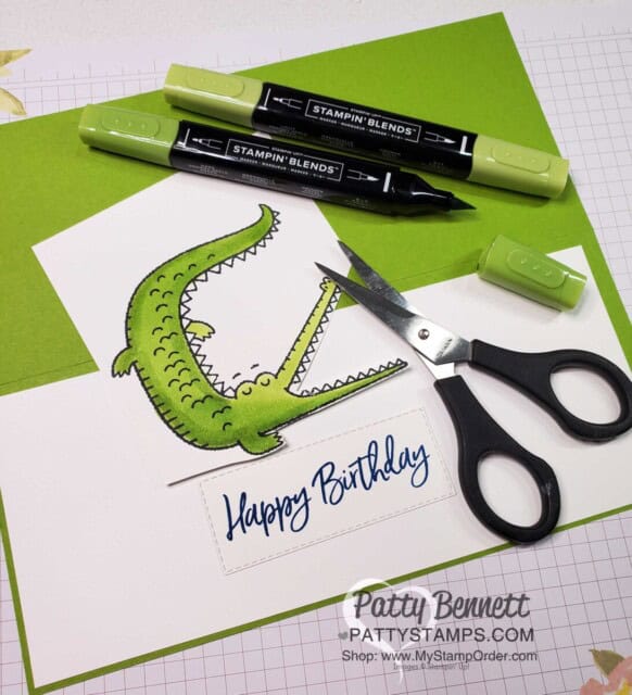 Stamp alligator image from the Oh Snap set and color with Granny Apple Green Stampin' Blends markers. Cut alligator in 2 pieces for the card front.