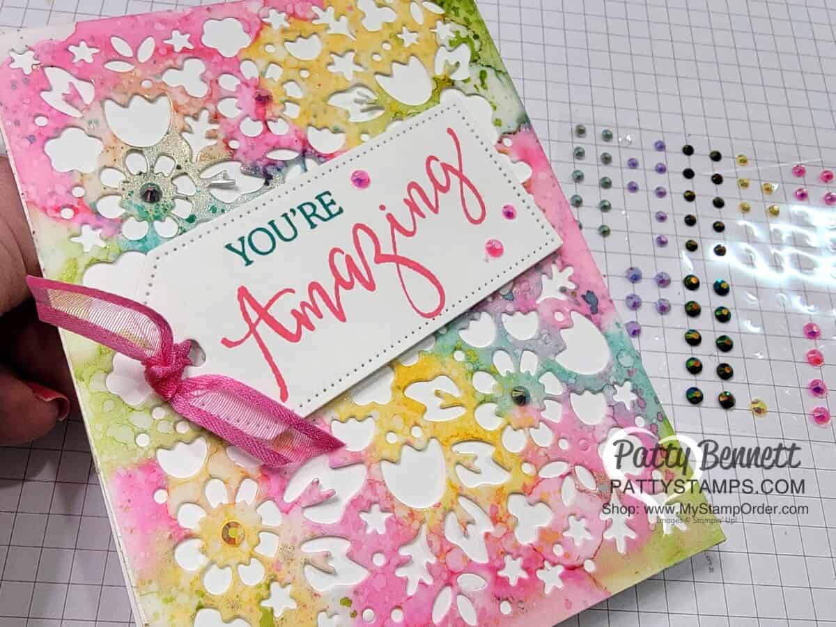 Die cut the Alcohol Ink background with the Flower Market die for a beautiful card and decorate with In Color Jewels! www.PattyStamps.com