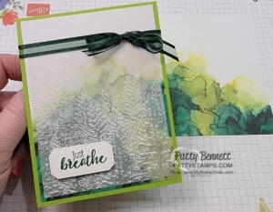 Expressions in Ink designer paper background for card created with embossed vellum and Evergreen Forest embossing folder by Patty Bennett