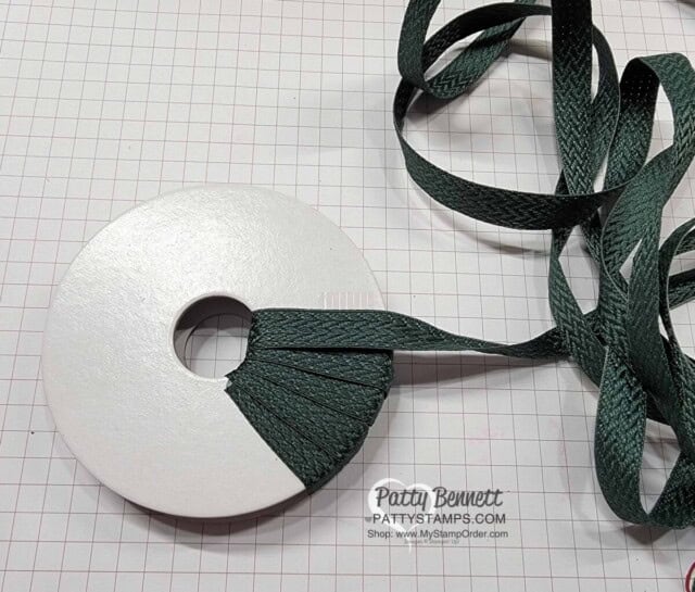 Wrap an empty ribbon spool with ribbon to make Cute Christmas Wreath Ornament with the Stampin' Up! Tidings and Trimmings bundle. DIY Christmas Craft idea!
