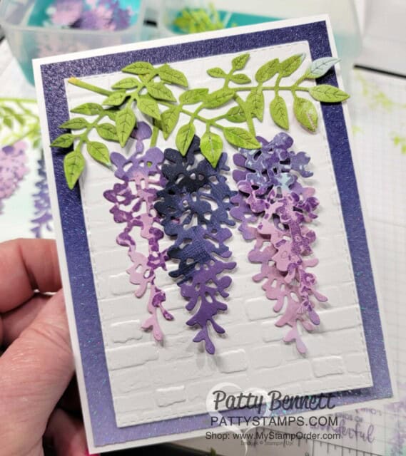 Wisteria Wishes Stampin' UP! card making bundle, die cut with Hues of Happiness designer paper, In Color Glimmer Paper and Brick and Mortar embossing Folder. by Patty Bennett