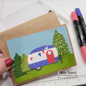 Stampin Up Sale-a-Bration 2022 Tree Lot Dies gift! Kraft Note card with cute camper and Into the Clouds embossing folder. by Patty Bennett