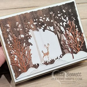 Use the Stampin Up! Grove dies to create a forest scene with the One Horse Open Sleigh designer paper. Winter Card by Patty Bennett