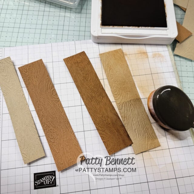 Emboss strips of Crumb Cake and Pecan Pie cardstock with the Timber embossing folder to create a wood look for the piers!