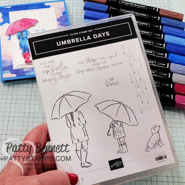 Use the STampin' UP! Everyday Skies 6x6 patterned paper stack for a great background on this Umbrella Days card colored with Stampin' Blend markers. Handmade card idea by Patty Bennett