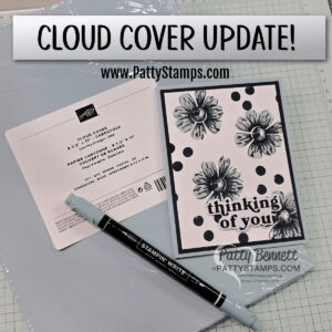 A Stampin’ Up! “Cloud Covers” light blue cardstock pack, a black-and-white floral handmade card with “thinking of you” text, and a dual-tip Stampin’ Write marker are on a white grid surface. “Cloud Cover Update!” and PattyStamps.com are shown at the top. To read more, visit Patty Stamps (pattystamps.com)