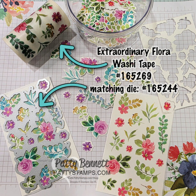A crafting workspace displays floral washi tape, die-cut floral stickers, metal dies, and cut-out flowers on a grid mat. Two arrows label the washi tape as “Extraordinary Flora Washi Tape #165269” and the die as “matching die: #165244.”. To read more, visit Patty Stamps (pattystamps.com)