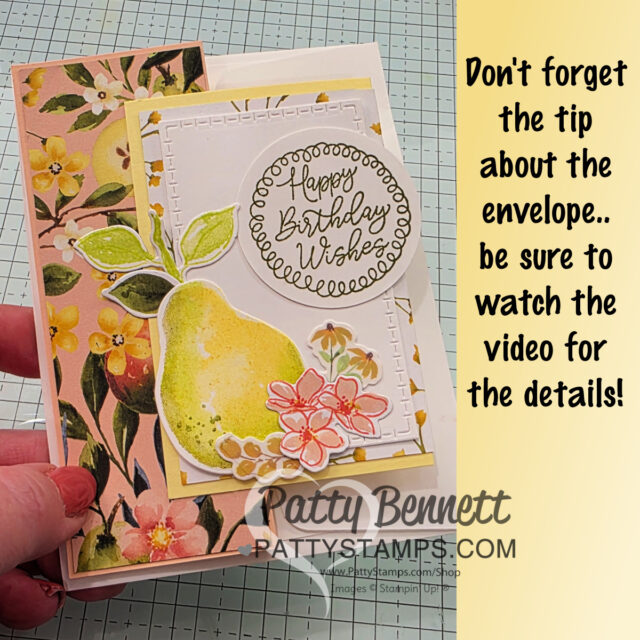 A hand holds a handmade birthday card decorated with painterly pears, flowers, and floral paper. Next to the card, text reads: “Don't forget the tip about the envelope... be sure to watch the video for details!” “Patty Bennett pattystamps.com” is watermarked. To read more, visit Patty Stamps (pattystamps.com)