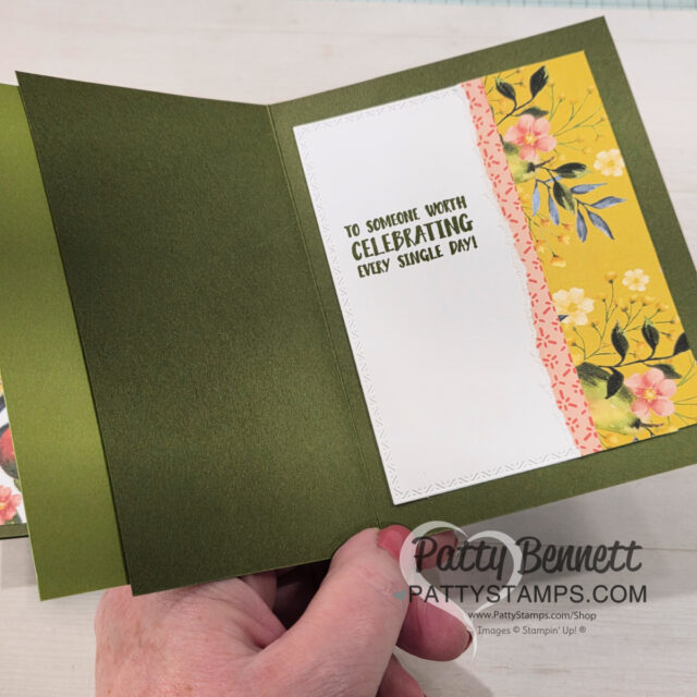 A hand holds an open green greeting card. Inside, a white panel with a stitched edge displays the message “TO SOMEONE WORTH CELEBRATING EVERY SINGLE DAY!” Floral yellow paper and a strip of coral lace decorate the right side. "PattyStamps.com" is watermarked below. To read more, visit Patty Stamps (pattystamps.com)