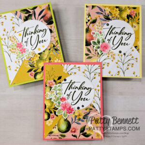Three handmade greeting cards with “Thinking of You” in elegant script on white circles. Each card features colorful floral and leafy patterns in yellow, pink, and green shades, with layered flower embellishments. “Patty Bennett PattyStamps.com” is printed on the photo. To read more, visit Patty Stamps (pattystamps.com)