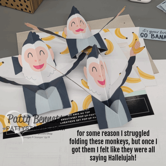 Three paper monkeys with outstretched arms and smiling faces pop up from a card. Bananas are scattered around them. Text reads: “for some reason I struggled folding these monkeys, but once I got them I felt like they were all saying Hallelujah!”. To read more, visit Patty Stamps (pattystamps.com)
