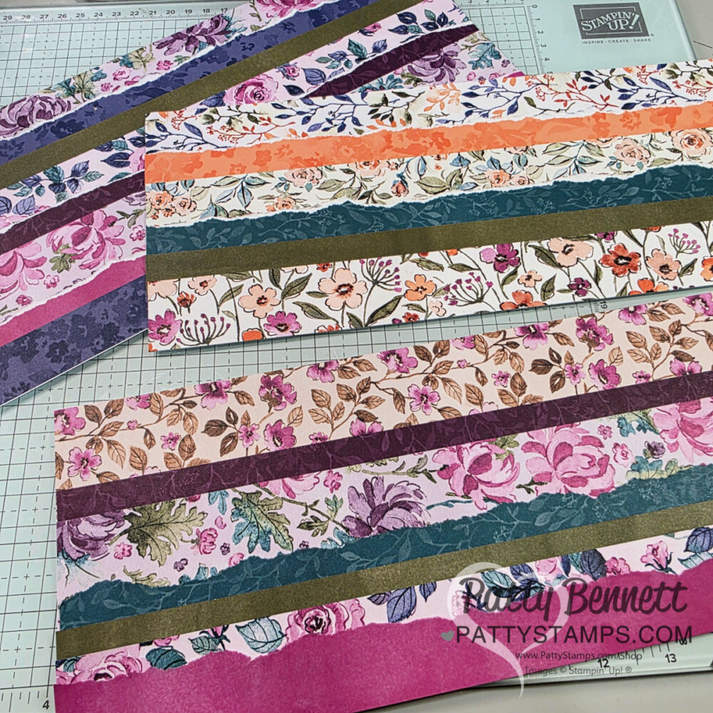 Several rectangular panels made of patterned paper strips are arranged on a crafting mat. The strips feature various floral, leafy, and textured designs in pink, purple, green, orange, and white tones. "Patty Bennett PATTYSTAMPS.COM" is visible on the lower right. To read more, visit Patty Stamps (pattystamps.com)