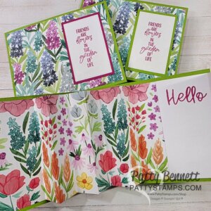 Three handmade floral cards are shown. Two feature colorful wildflowers and sentiments reading "Friends are flowers in the garden of life." The third card has a flower-filled border and the word "Hello" in pink script. All cards use vibrant, watercolor-style artwork. To read more, visit Patty Stamps (pattystamps.com)