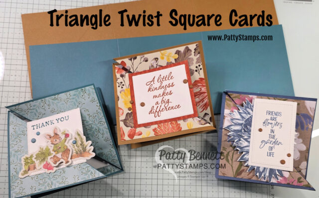 Three handmade “Triangle Twist Square Cards” are displayed on a craft table. Each card features layered papers, floral designs, and uplifting messages like “Thank You,” “A little kindness makes a big difference,” and “Friends are flowers in the garden of life.”. To read more, visit Patty Stamps (pattystamps.com)