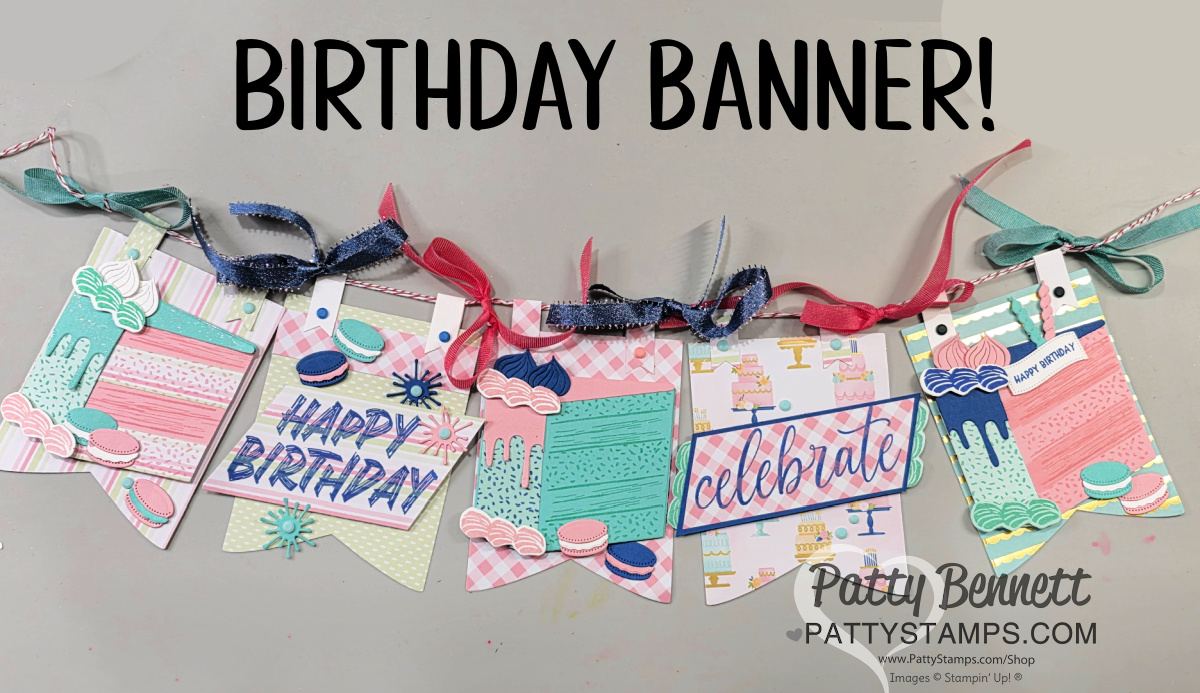A colorful, handmade birthday banner with six flag-shaped panels decorated with layered paper designs, cupcakes, and greetings like “HAPPY BIRTHDAY” and “celebrate.” The panels are strung together with pink and blue ribbons. “BIRTHDAY BANNER!” is at the top. To read more, visit Patty Stamps (pattystamps.com)