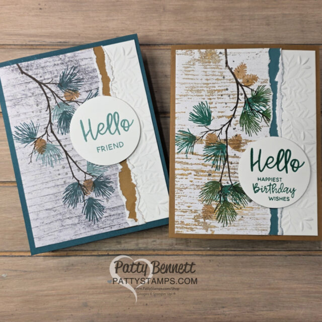 Two handmade greeting cards with pine branch designs are displayed on a wooden surface. Each has a "Hello" message in green script on a white circle. The left card says "Friend" and the right "Happiest Birthday Wishes." Both cards feature textured and layered backgrounds. To read more, visit Patty Stamps (pattystamps.com)