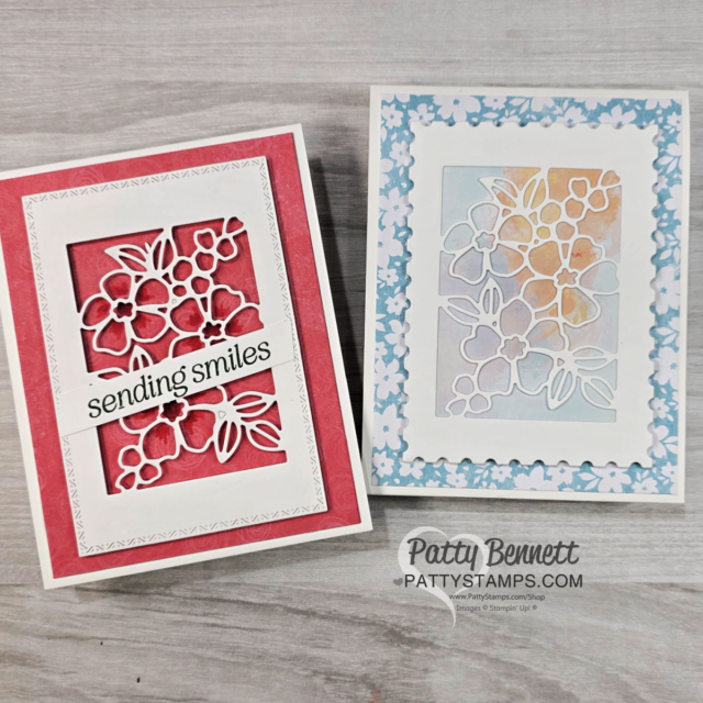 Two handmade greeting cards with floral designs. The left card has a red background, white floral cutout, and "sending smiles" text. The right card has a blue floral frame, pastel watercolor background, and a white floral cutout. Both are on a light wood surface. To read more, visit Patty Stamps (pattystamps.com)