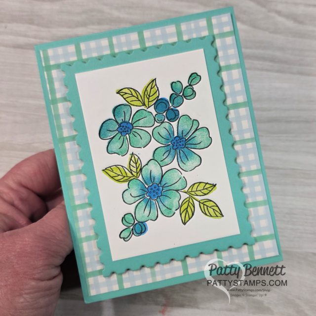 A hand holding a card. To read more, visit Patty Stamps (pattystamps.com)