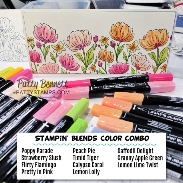 A handmade card with colorful stamped and colored flowers stands behind markers in pink, orange, yellow, and green hues. A label in front lists “Stampin’ Blends Color Combo” and names the marker shades used for the card’s vibrant floral design. To read more, visit Patty Stamps (pattystamps.com)