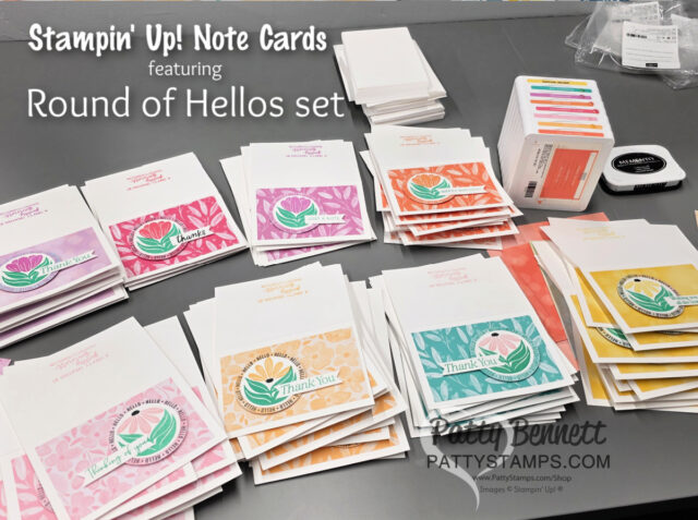 Rainbow of Note Cards featuring retiring In Colors from Stampin' UP! A tabletop displays stacks of handmade notecards in pink, orange, yellow, and green, each with floral designs and “Thank You” messages. Stamp pads, ink, and envelopes are also visible. Text on the image promotes Stampin’ Up! Note Cards and the Round of Hellos set. To read more, visit Patty Stamps (pattystamps.com)