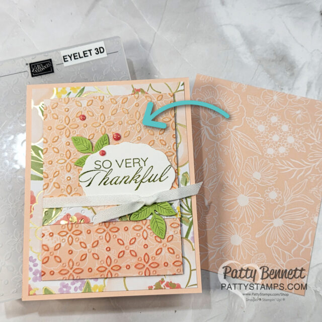 A handmade card with a peach embossed floral design, green leaves, two red dots, and a white label reading "SO VERY Thankful" accented by a white ribbon. An arrow points to the embossed section. Stampin’ Up! embossing folder and envelope are visible nearby. To read more, visit Patty Stamps (pattystamps.com)