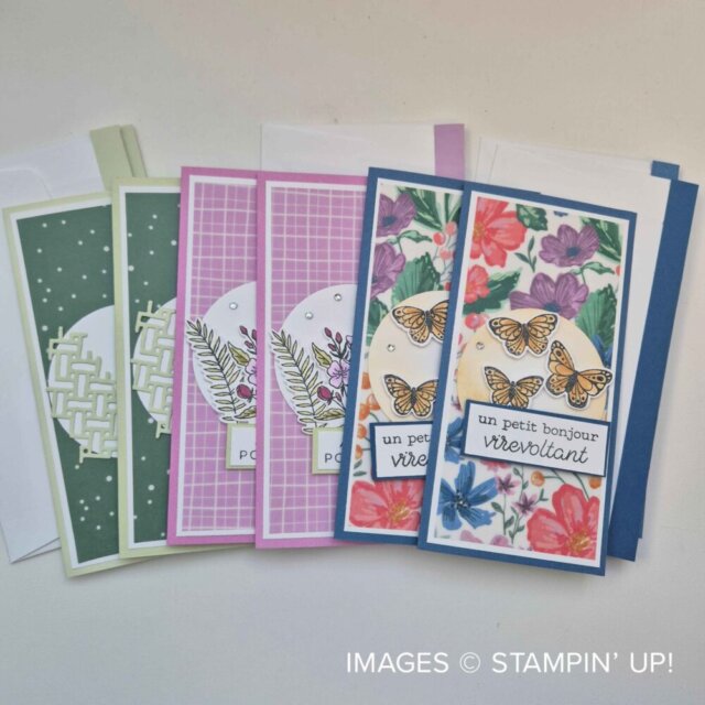A set of five handmade greeting cards with floral and butterfly designs, each with different pastel-colored borders and backgrounds. The cards feature French text and decorative die cuts. White envelopes are placed behind the cards. To read more, visit Patty Stamps (pattystamps.com)