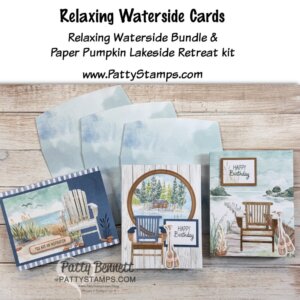 Three handmade waterside-themed birthday cards with envelopes are displayed on a wooden surface. Each card features Adirondack chairs, calming lake scenes, and soft blue and brown tones. Text reads, “Relaxing Waterside Cards” and details about kits from PattyStamps.com. To read more, visit Patty Stamps (pattystamps.com)