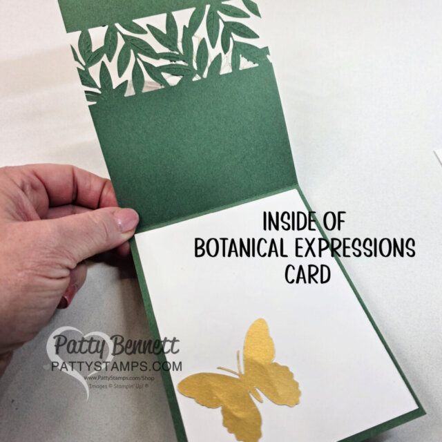 A hand holds open a green greeting card. The inside top has leafy cutout designs, and the bottom features a gold butterfly on a white panel. Text reads: “INSIDE OF BOTANICAL EXPRESSIONS CARD.” “PattyStamps.com” is printed in the corner. To read more, visit Patty Stamps (pattystamps.com)
