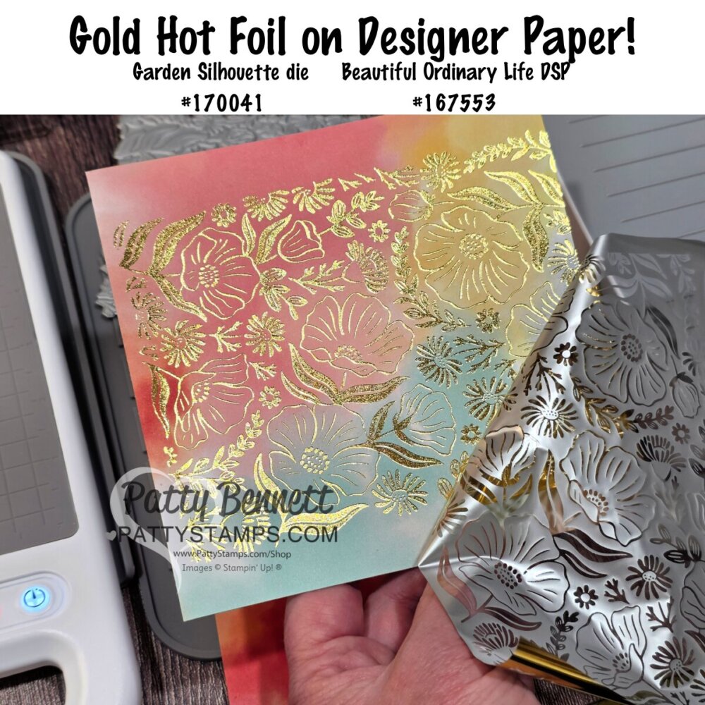 A hand holds a floral-etched silver foil plate next to gold hot foiled flowers on rainbow pastel designer paper. A die-cutting machine sits on the left. Text at the top describes the products and tools used for this crafting technique. To read more, visit Patty Stamps (pattystamps.com)