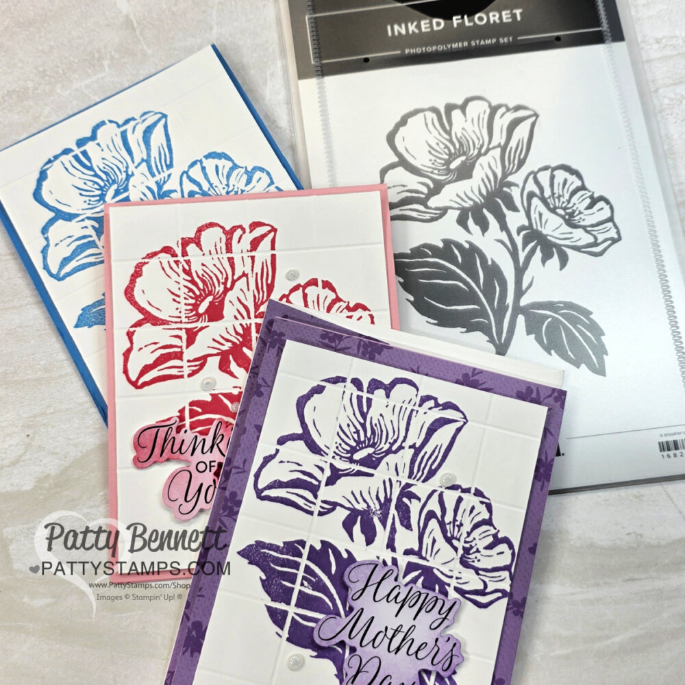 Three handmade cards with large floral designs in blue, red, and purple are displayed. Each card has a thoughtful sentiment and is bordered in matching color. To the right is a black-and-white floral photopolymer stamp set labeled “Inked Floret.”. To read more, visit Patty Stamps (pattystamps.com)