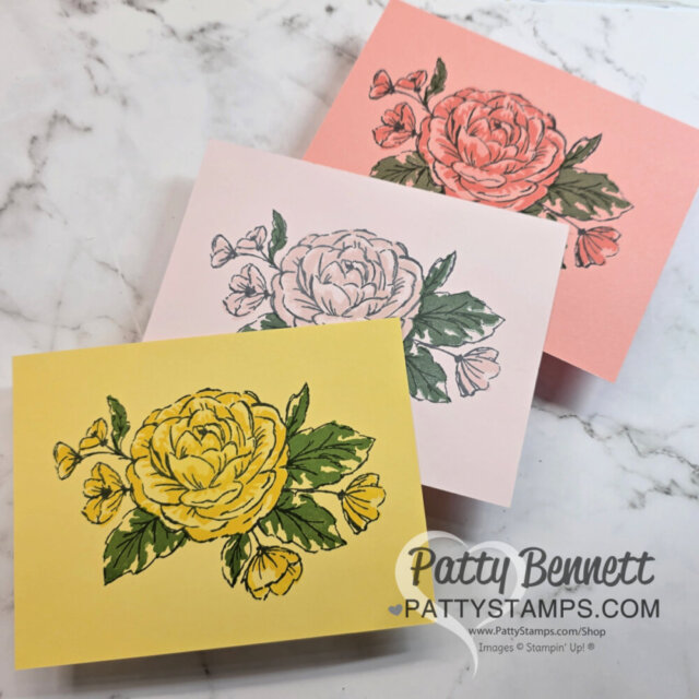 Three handmade cards with large peony flower designs are arranged on a marble surface. One card is pink with a red flower, another is pale pink with a black outline flower, and the third is yellow with a yellow flower. “Patty Bennett” is watermarked. To read more, visit Patty Stamps (pattystamps.com)